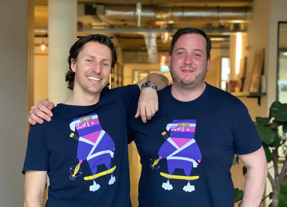 Two members of the Kaizo team in Kaizo ninja T-shirts at the Amsterdam office